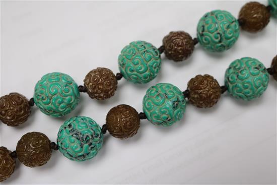 A carved turquoise and agate bead necklace.